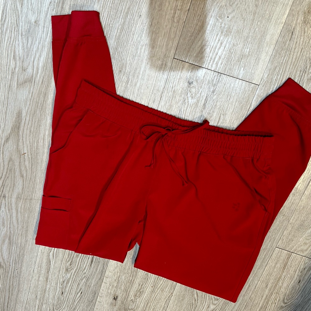 Sketchers, red scrubs pants